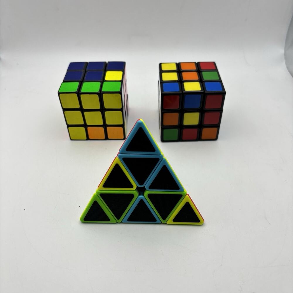 2 - Rubiks Cubes and 1 - Pyraminx Triangle Puzzle. VG Condition.